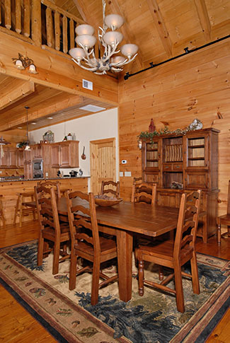 Deluxe Cabin dinning room area with plenty of seating overlooking a Smoky Mountain View